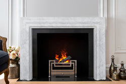 Bisous hand-carved marble fireplace mantel by Marmoso