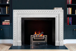 Eternelle hand-carved marble fireplace mantel by Marmoso