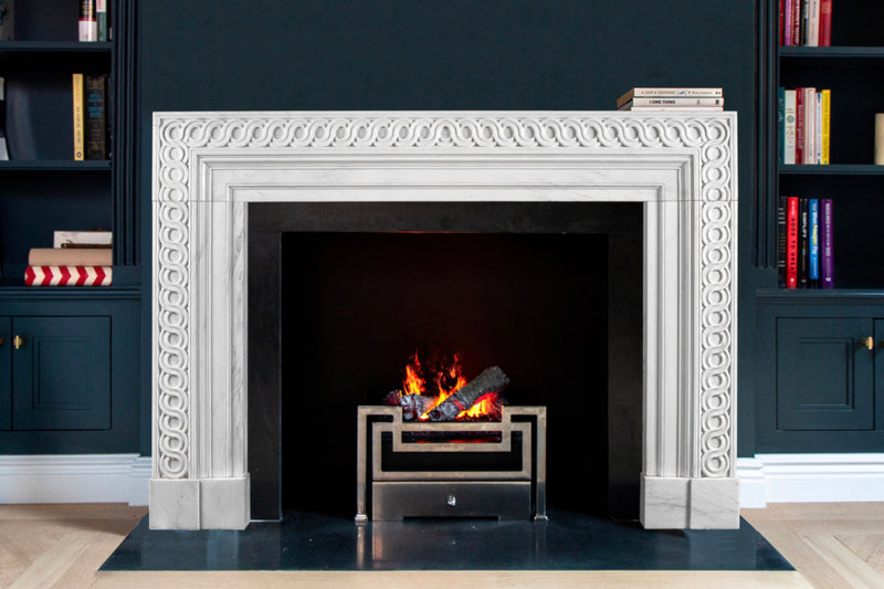 Eternelle hand-carved marble fireplace mantel by Marmoso